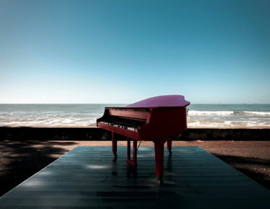 The image of the piano at the beach